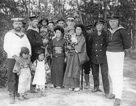 image: A commemorative photograph taken with local residents