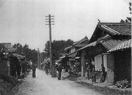 image: A village where utility poles are erected